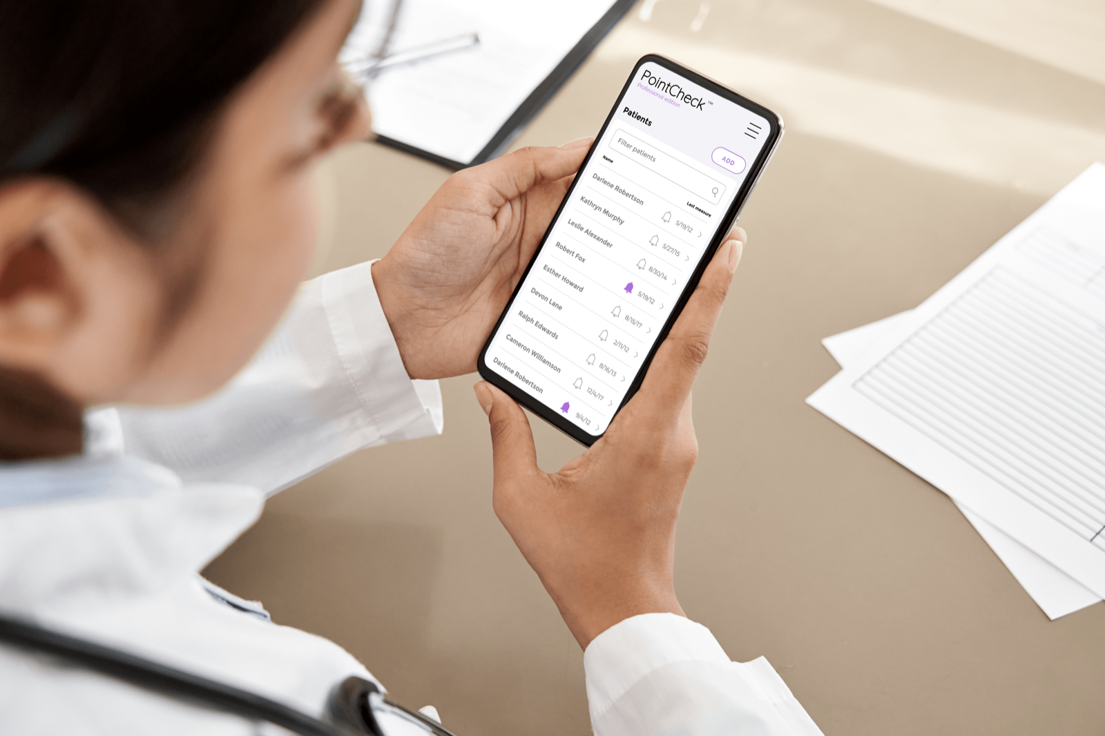 A clinician reviews a patient's PointCheck™ result on a tablet during a clinic visit.